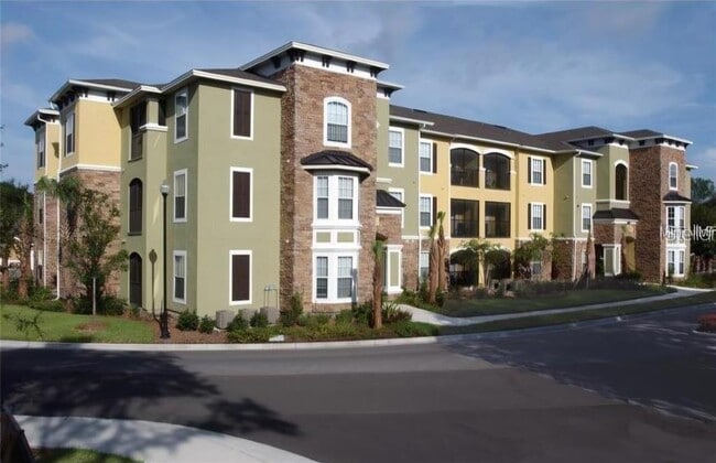 Building Photo - 10211 Courtney Palms Blvd Unit 304