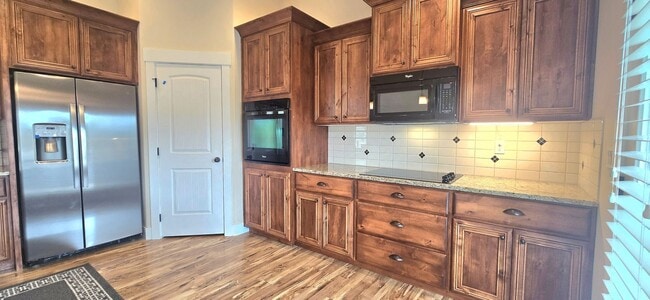 Photo - THREE-CAR GARAGE! This charming home offers 3 bedrooms, plus an office/rec room, and 2 bathrooms.