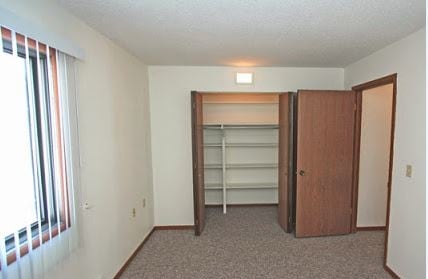 Bedroom and Closet - Regency Villa of Harlan