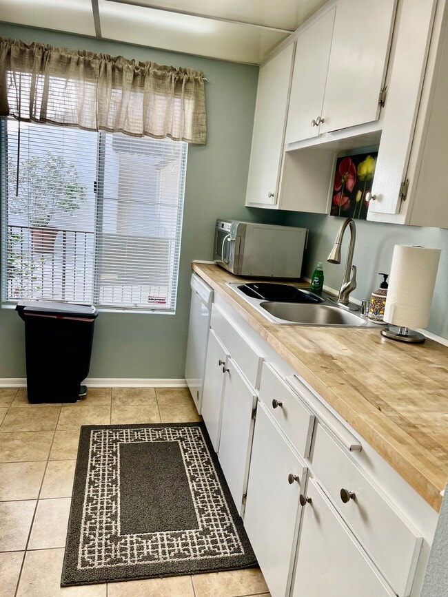 Butcher block counter tops and lots of light. - 4111 Summertime Ln Unit 4111