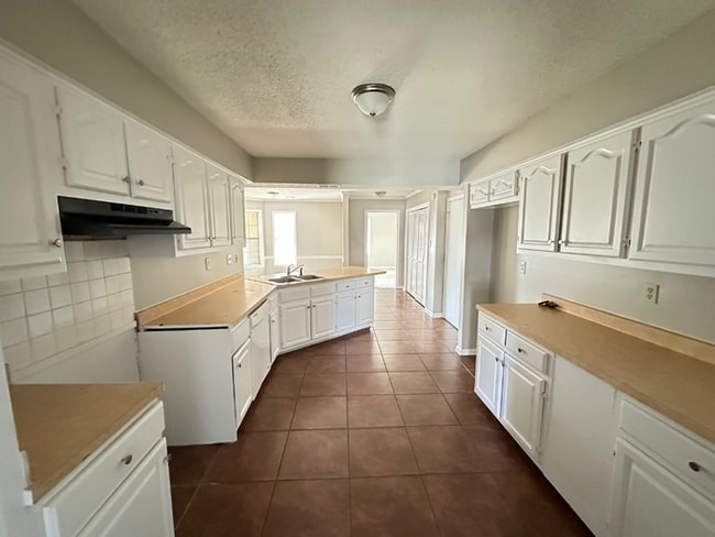 Photo - Grand 4BR/2BA Near Southwind | 2,438 Sq Ft, Stone Fireplace, Soaking Tub & 2-Car Garage
