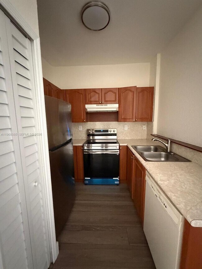 Building Photo - 7100 NW 177th St Unit 210-14