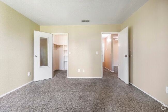 View of bedroom from window towards hallway