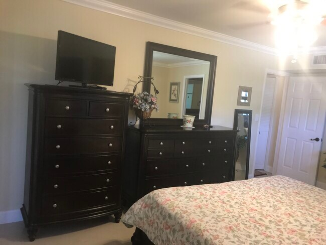 master bedroom w/king bed set in cherry - 225 Deer Creek Blvd Unit 905