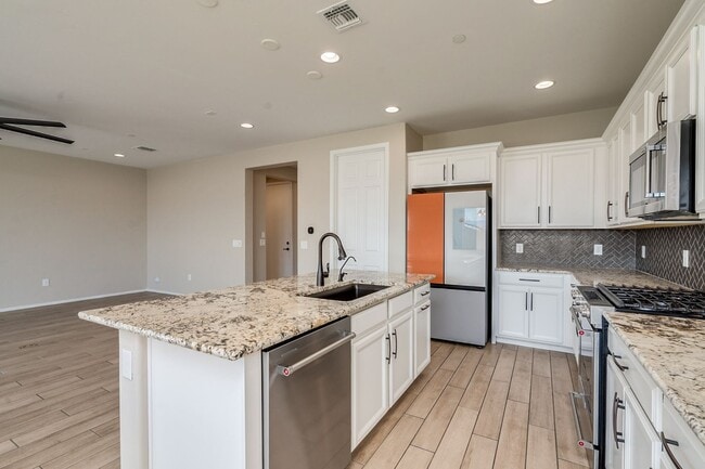 Photo - Amazing 4BR 2.5BA Home w/ 3-Car Tandem Garage • Pool Access • Yard w/ Fire Pit in Saguaro Trails