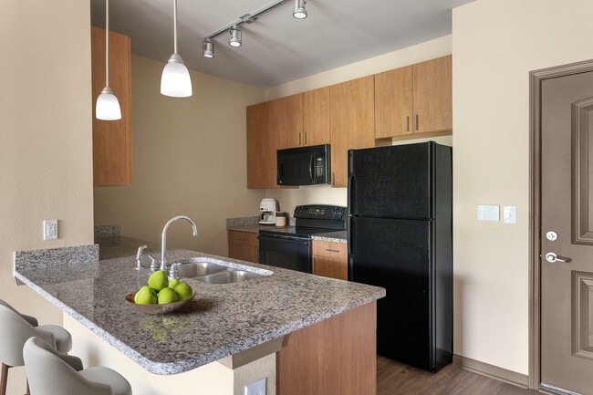 Experience the elegance of a modern kitchen designed for convenience and style.