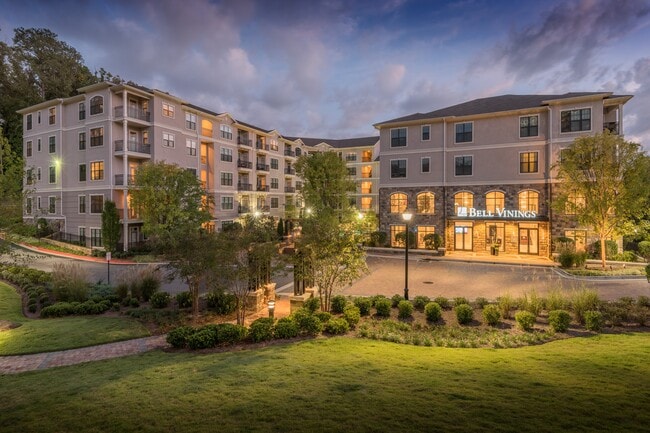 Lush landscaping and modern design create the perfect first impression.