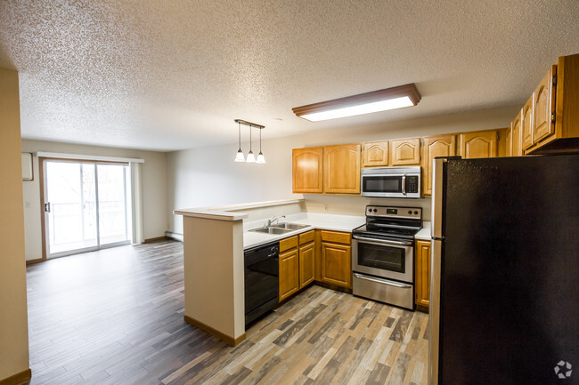 Gorgeous Kitchen &amp; Living Rooms Featuring Faux Wood Flooring - Pebble Springs Rental