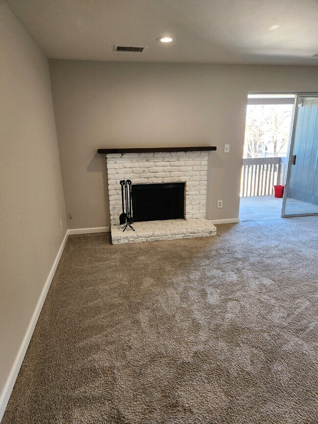 Wood burning fireplace - 7337 S Xenia Cir Unit Hunter Hill Apartments