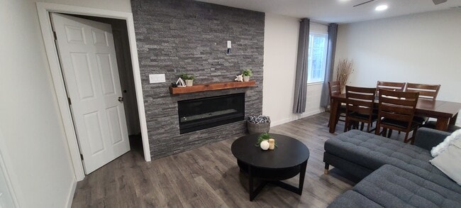 Living room with stone fireplace wall - 514 Osborn Ln