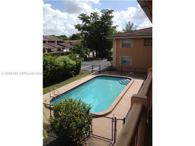 Building Photo - 8704 NW 35th St Unit 202