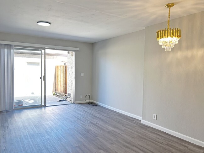 Photo - Move-in ready Evergreen townhome with private backyard, detached 2-car garage, and great communit...
