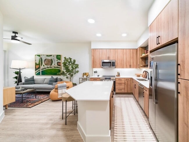 Open-concept living at Modera St. Paul combines sleek kitchens with inviting lounges, creating the perfect setting for life in downtown Dallas.