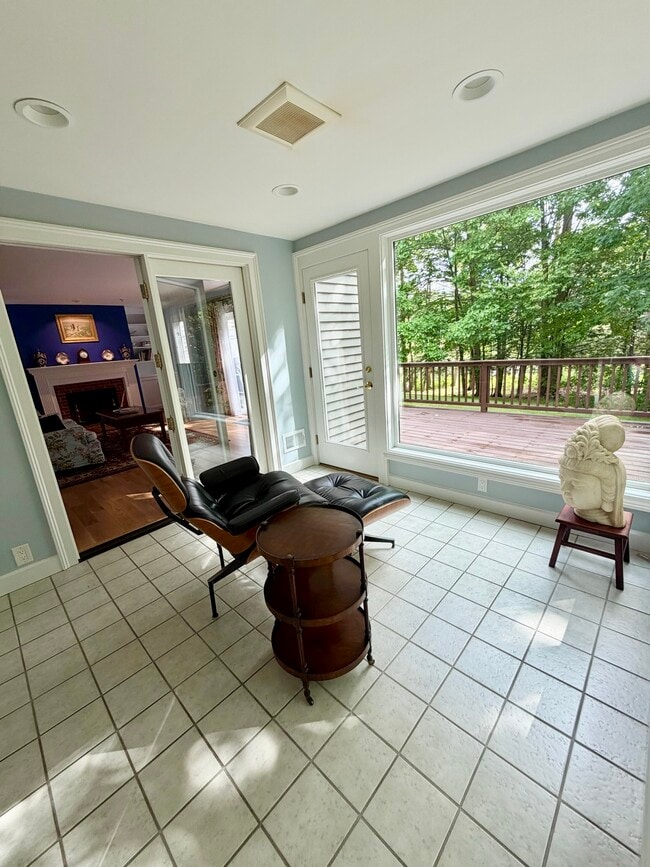Sunroom with entry to LR & Primary Suite - 67 Peninsula Dr