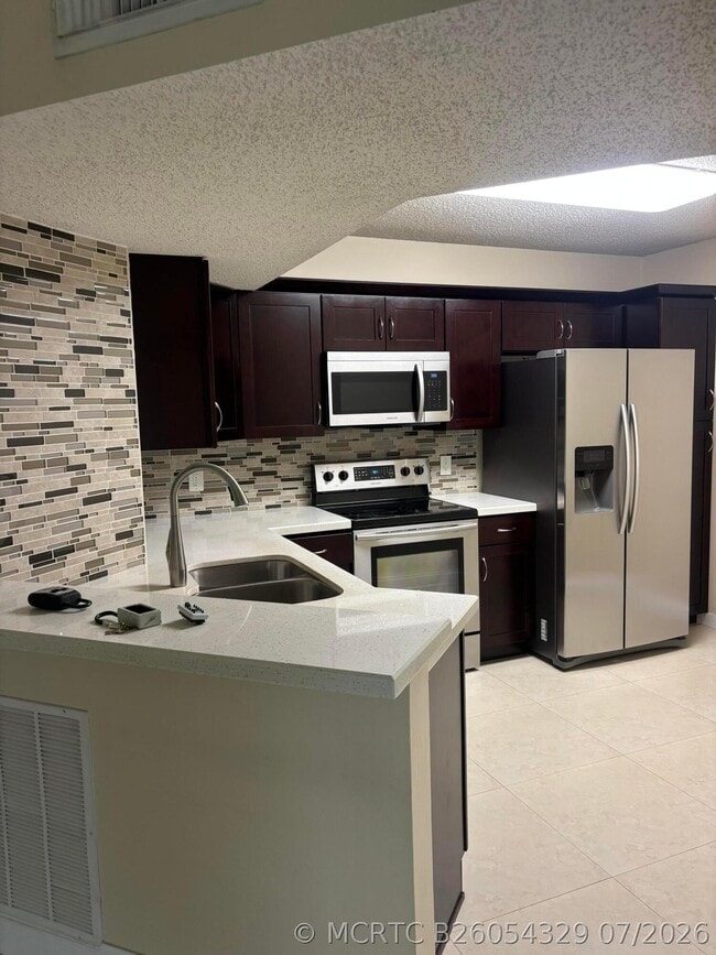 Photo - 8761 Wiles Rd Unit 304
