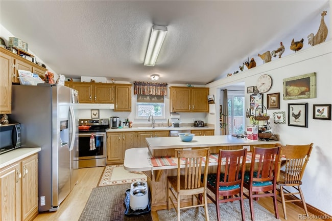 Photo - 9040 W 64th Pl