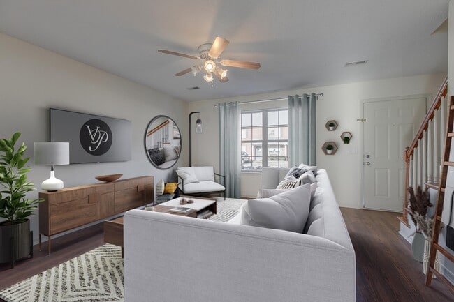 Spacious Living Room with Hardwood Style Flooring - Victoria Place Townhomes