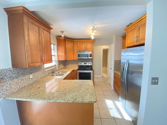 Photo - 2/2 home with garage - tile on inside with...