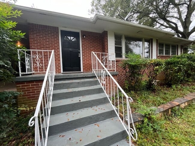 Building Photo - COMING SOON: Classic charm, peaceful living, your Forest Park retreat awaits in this spacious 3-b...