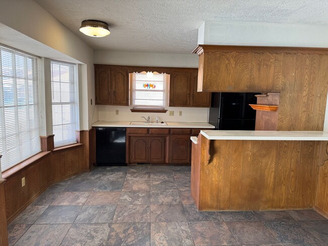 Photo - 3 bed, 2 bath, 2 car with 2 extra living spaces and new appliances, paint and carpet! Located clo...