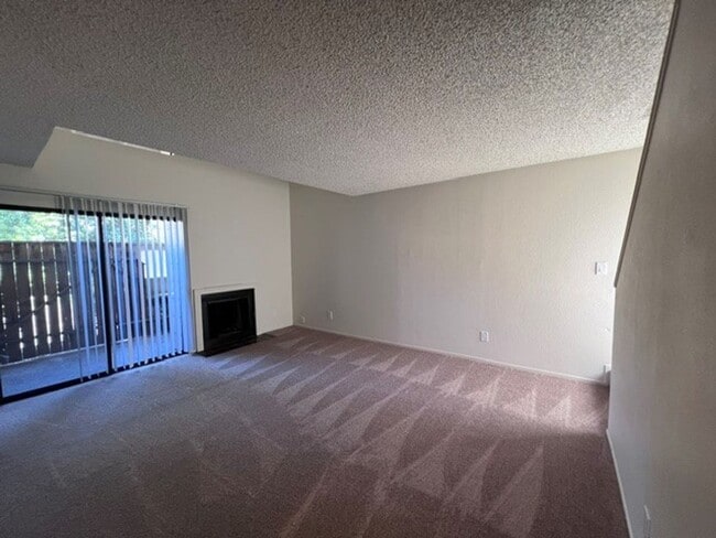 Photo - Freshly painted condo with new carpet in gated community.