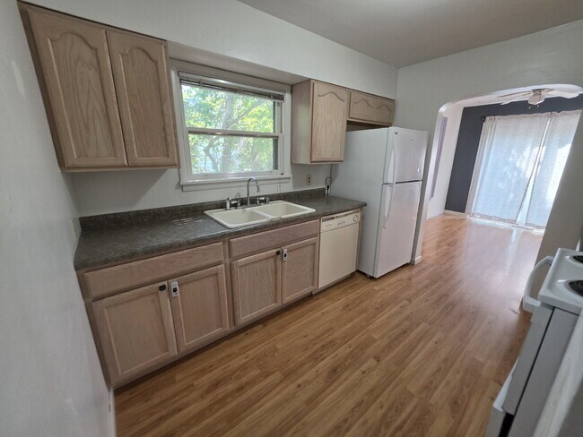 2 Bedroom, 1 Bathroom West Hill Home with Fenced Yard, Garage, & Bonus Living Space