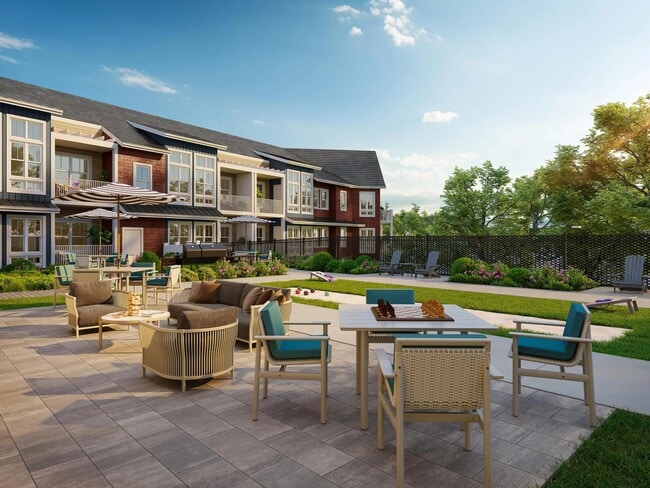 Outdoor courtyard with versatile seating, shaded areas, and open green space designed for casual gatherings, games, and relaxed afternoons.