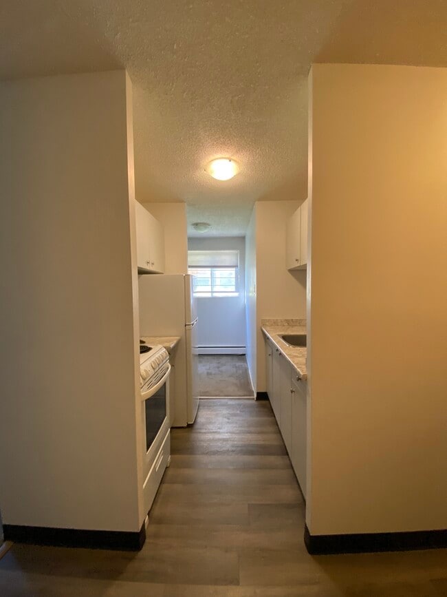 Photo - 1 Bedroom Lower-Level Suite in Bankview – Available Immediately Unit 101