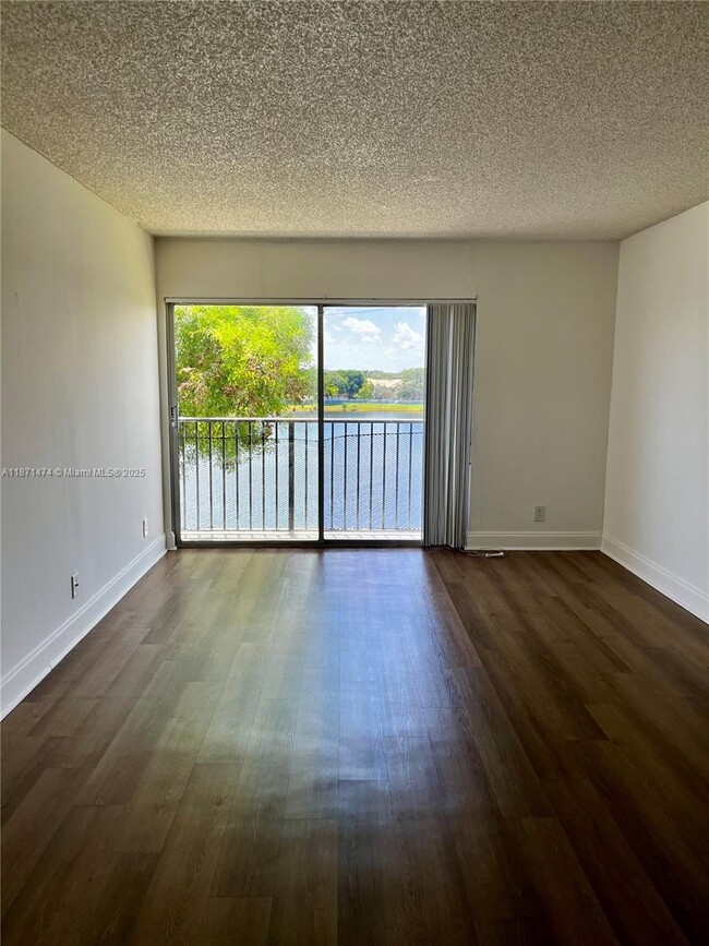 Building Photo - 8600 N Sherman Cir Unit 405 Rental