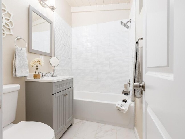 Smaller bedroom has an attached private bathroom. - 665 Cathedral Dr