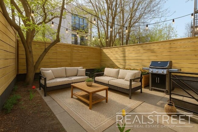 Photo - STUNNING 4+ BED 3 BATH DUPLEX + YARD IN PRIME BUSHWICK TOWNHOUSE Unit 1