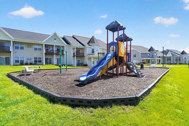 Unwind in a vibrant community featuring a spacious playground designed for fun and relaxation. Perfect for families seeking quality outdoor spaces. Choose Mansions at Delmar for your next home. Schedule a visit today!