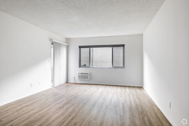 1BR, 1BA - 785SF - Living Room - Cedar Tropics Unit J