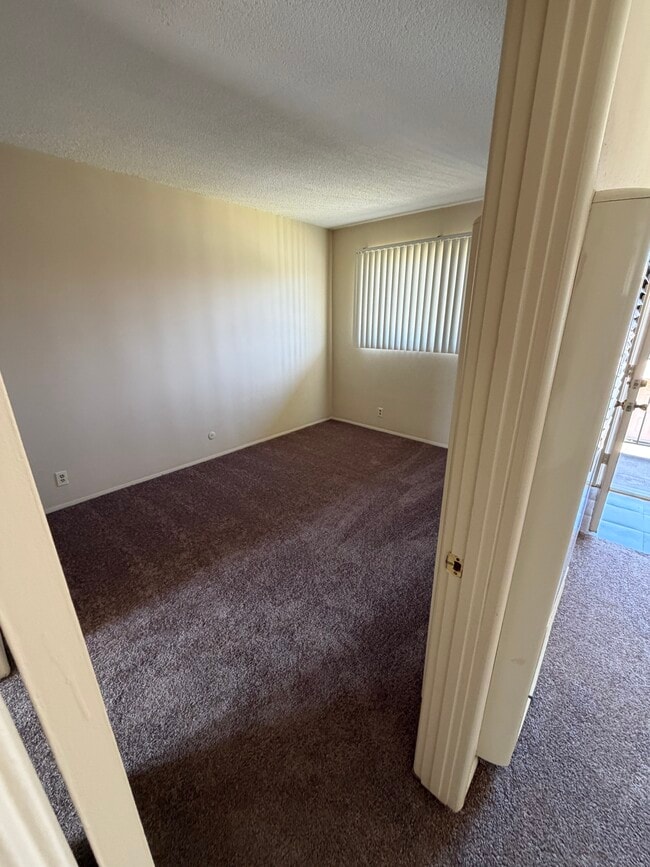 Bedroom from living room - 2133 Elden Ave Unit Elden East Apartments