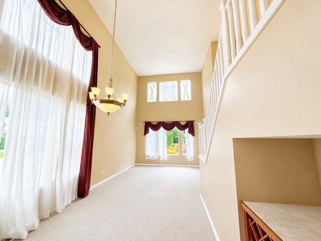 Photo - Spacious 4-Bedroom Home with Bonus Room, Trex Deck & Pergola in Prime Maple Valley