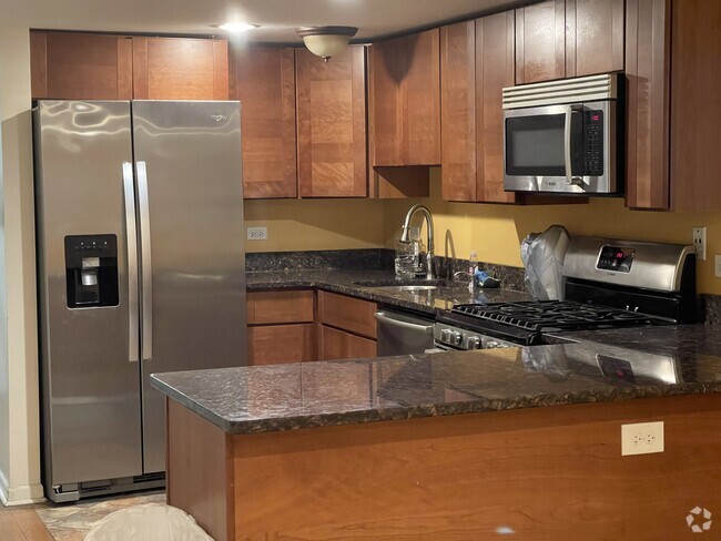 Building Photo - 8615 S Colfax Ave Unit Garden apt