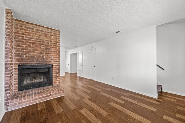 Living room with fireplace - 6913 Wentworth Dr Unit #C
