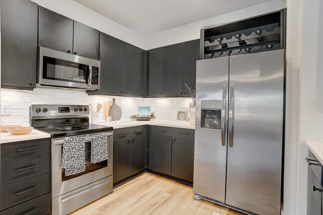 Kitchen with Quartz Countertop and Stainless Steel Appliances.