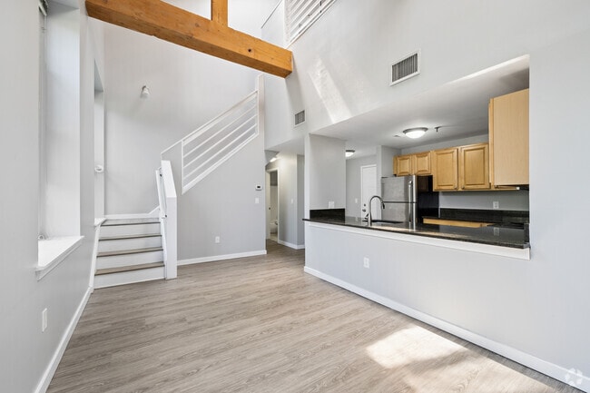 1BR, 2BA - 1,090SF - Kitchen and Living Room - Beacon Mill Village
