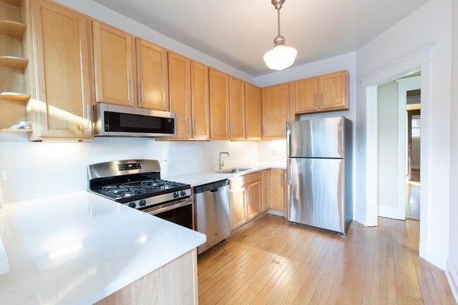 Building Photo - 1409 W Belle Plaine Ave Unit 1W