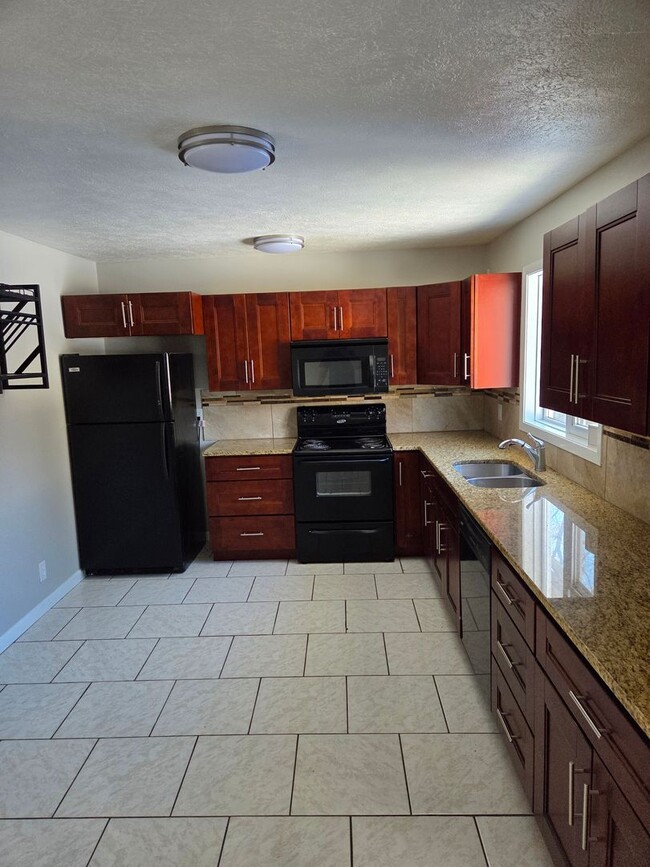 Photo - 4 bed 2.5 bath with a 2 car garage and fenced backyard