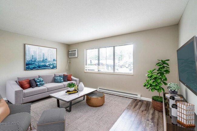 Updated Apartments Featuring Hardwood Style Floors, Carpeted Bedrooms, Neutral Paint Schemes, Granite Style Counters, Hardwood Style Floors, Shaker Style Cabinets, Matching Stainless Steel Appliances, Spacious Closets