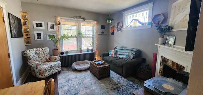 Spacious Living Room with Large Windows & Natural Light. - 822 E 4th St Apartments Unit #3