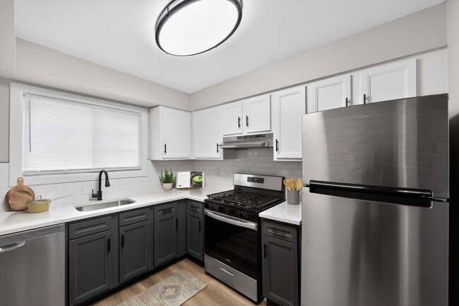 Welcome to Lake Shore Park Apartments, where modern design meets functionality in our beautifully appointed kitchens. Enjoy sleek appliances, ample storage, and a welcoming atmosphere. Schedule a tour today to see your new home! - Lake Shore Park Apartments