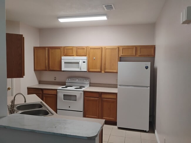 New dish washer, faucet and refrigerator. Range 2 year old.