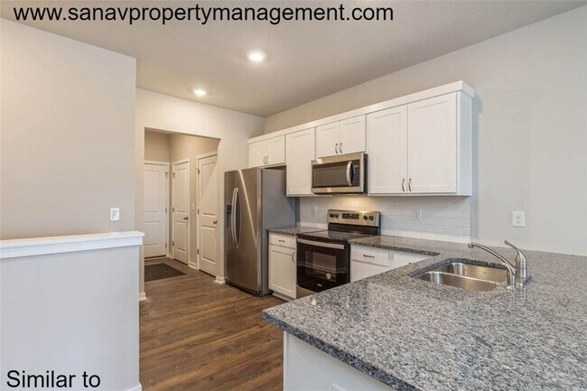 Photo - Modern Charm: 2-Bedroom, 2-Bathroom Home with Open Floor Plan and Rear Load Garage