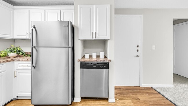 Revel in our updated kitchens featuring a stainless-steel appliance ensemble that includes a stove, microwave, refrigerator, and dishwasher.