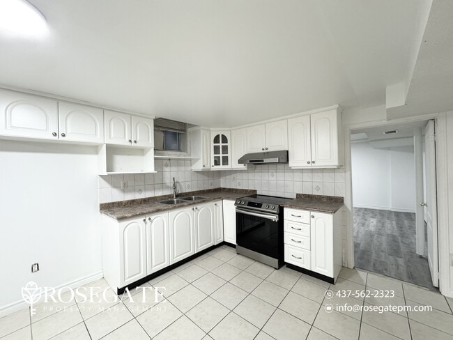 Photo - Spacious 2-Bedroom Basement Apartment with... Unit 2