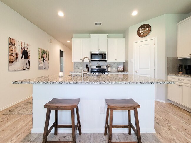 Photo - Experience tranquility in this impressive single-story, three-bedroom, two-bath home in Barton Wo...