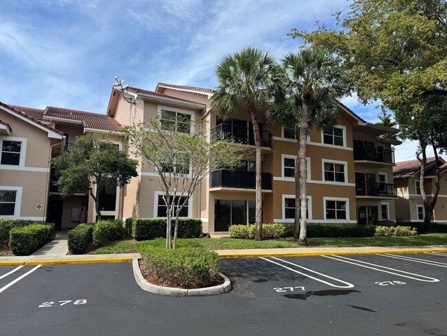 Building Photo - 8955 Wiles Rd Unit 206